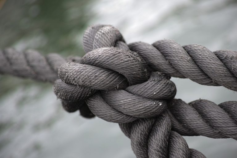 togetherness, tying, teamwork, business, old, material, gray, security, part of, outdoors, distraught, worried, sailing, sea, nature, rope, stability, anxiety, friendship, remote, tangled, tied knots, moored, physical pressure, toughness, strength, cooperation, partnership, unity, emotional stress, equipment